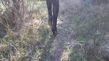 Walking On The Wood Wearing A Black Dress Pantyhose And High Heels Ankle Boots